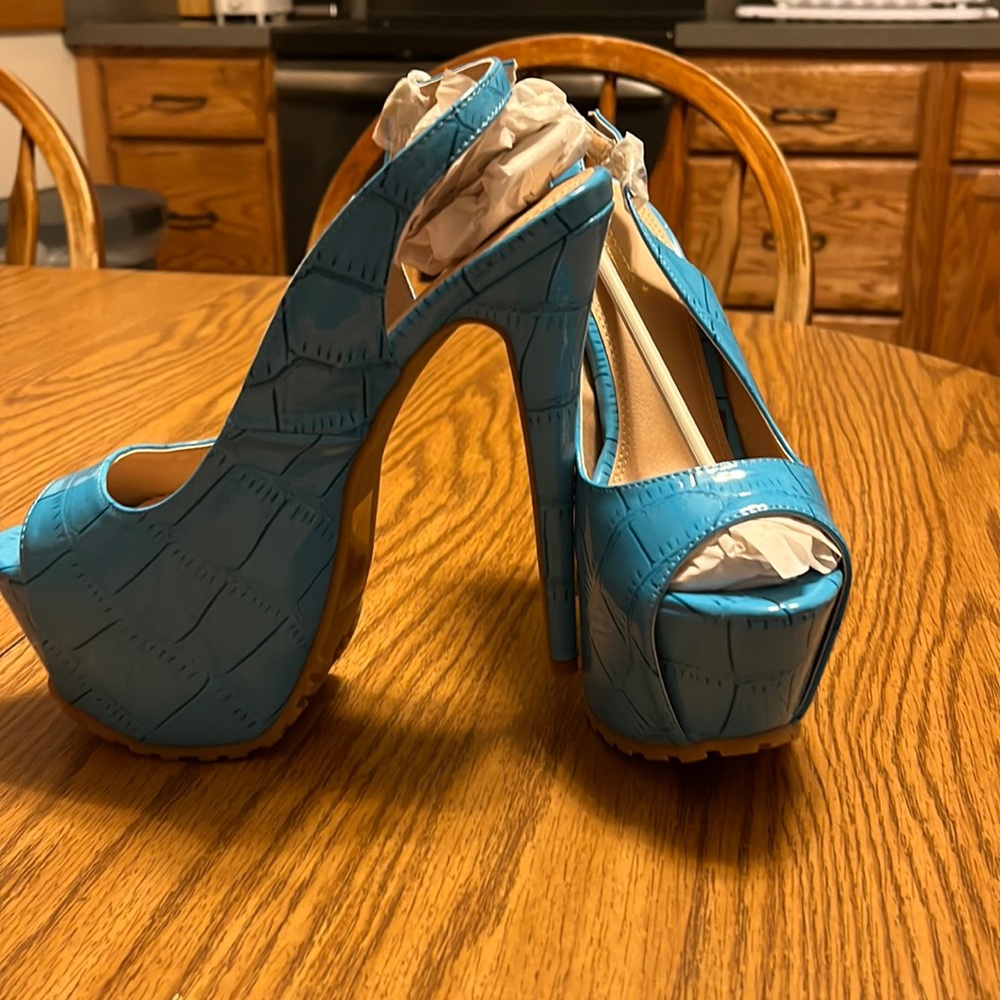 Blue open toed, strapped back heels
